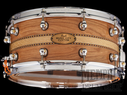 Pearl 14x6.5 Music City Custom Solid Cherry Snare Drum with a White Oak Inlay